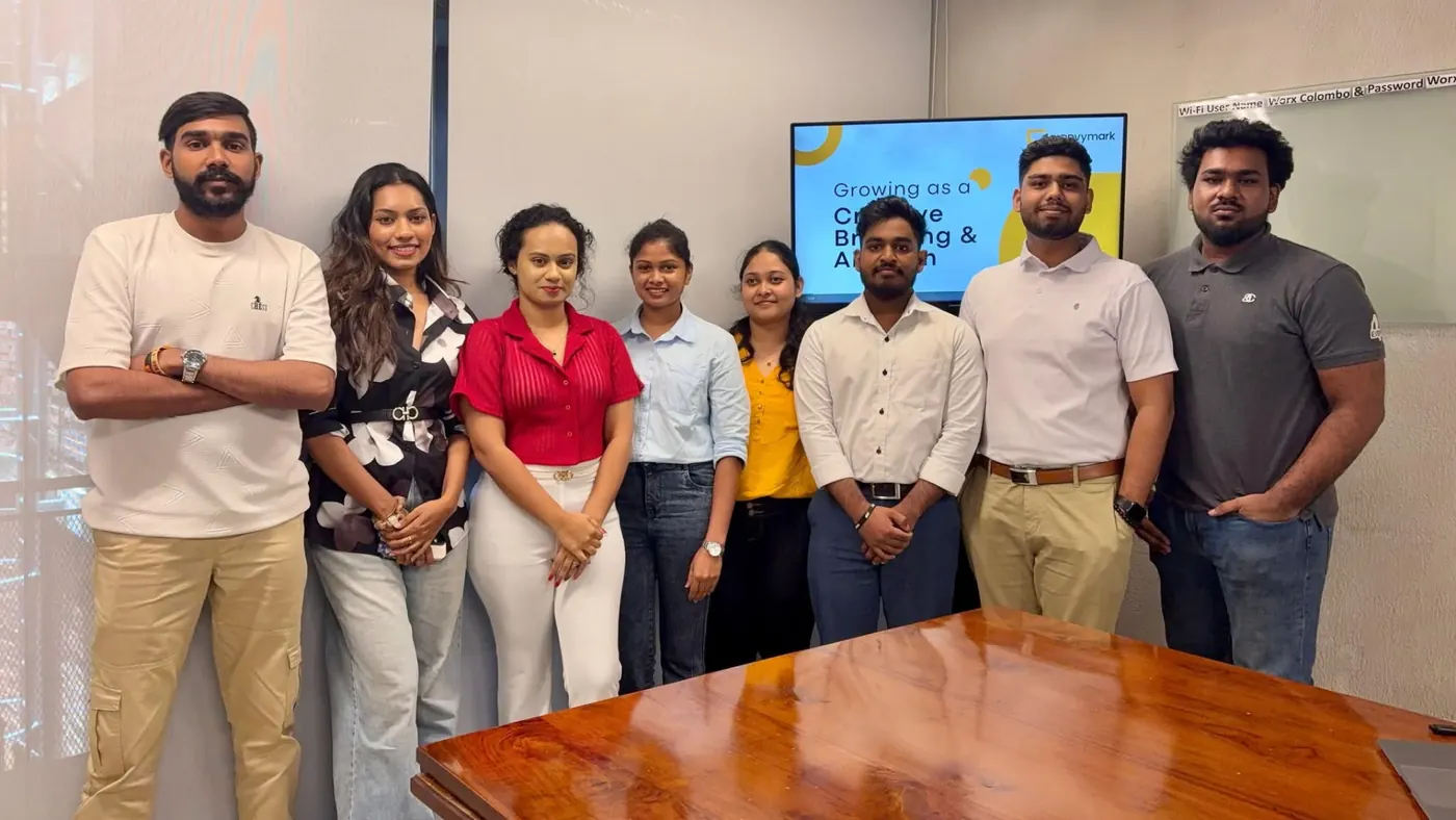 Eight of the twelve-person team together in the Colombo office.